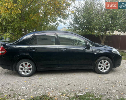 Черный Ниссан Тиида, объемом двигателя 1.6 л и пробегом 304 тыс. км за 4600 $, фото 2 на Automoto.ua