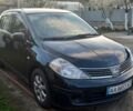 Черный Ниссан Тиида, объемом двигателя 1.8 л и пробегом 270 тыс. км за 2900 $, фото 1 на Automoto.ua