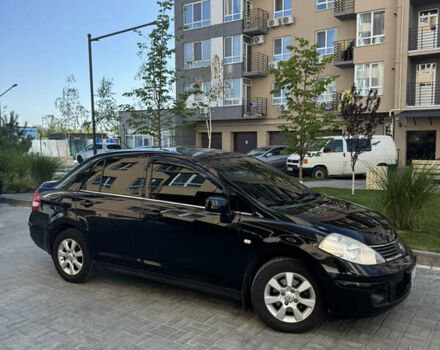 Черный Ниссан Тиида, объемом двигателя 1.6 л и пробегом 165 тыс. км за 7000 $, фото 1 на Automoto.ua