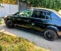 Черный Ниссан Тиида, объемом двигателя 1.6 л и пробегом 240 тыс. км за 6000 $, фото 1 на Automoto.ua