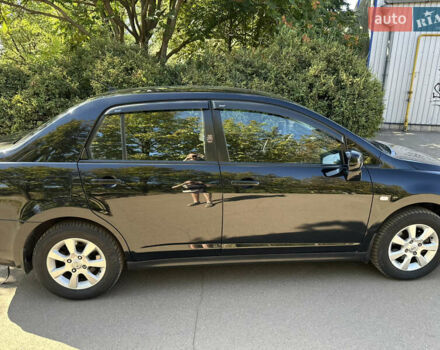 Чорний Ніссан Тііда, об'ємом двигуна 1.6 л та пробігом 121 тис. км за 4950 $, фото 1 на Automoto.ua