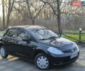 Черный Ниссан Тиида, объемом двигателя 1.6 л и пробегом 222 тыс. км за 4600 $, фото 1 на Automoto.ua