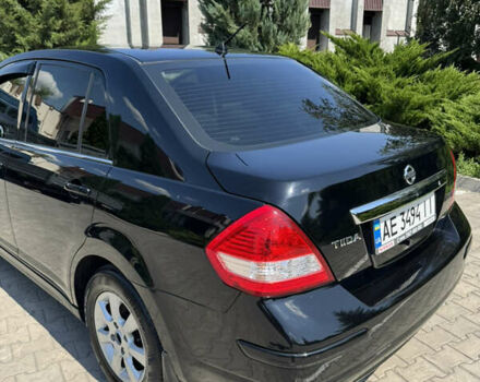 Черный Ниссан Тиида, объемом двигателя 1.6 л и пробегом 165 тыс. км за 7000 $, фото 52 на Automoto.ua