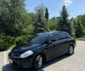 Черный Ниссан Тиида, объемом двигателя 1.6 л и пробегом 165 тыс. км за 7000 $, фото 4 на Automoto.ua