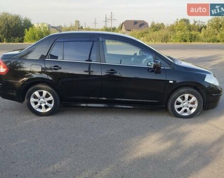 Черный Ниссан Тиида, объемом двигателя 1.8 л и пробегом 110 тыс. км за 7300 $, фото 1 на Automoto.ua