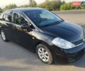 Черный Ниссан Тиида, объемом двигателя 1.8 л и пробегом 110 тыс. км за 7300 $, фото 1 на Automoto.ua