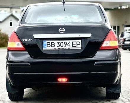 Черный Ниссан Тиида, объемом двигателя 1.6 л и пробегом 170 тыс. км за 4199 $, фото 1 на Automoto.ua