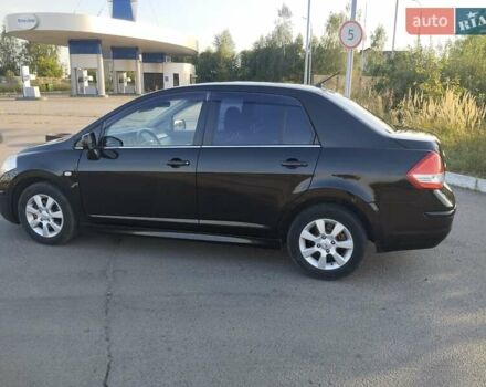 Черный Ниссан Тиида, объемом двигателя 1.8 л и пробегом 110 тыс. км за 7300 $, фото 9 на Automoto.ua