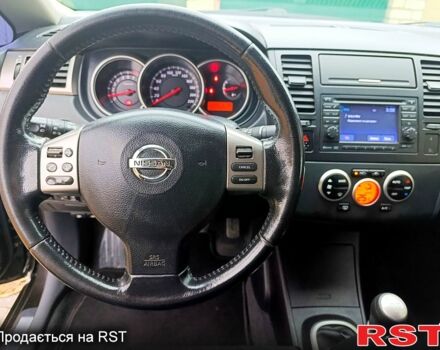Черный Ниссан Тиида, объемом двигателя 1.8 л и пробегом 110 тыс. км за 5600 $, фото 10 на Automoto.ua