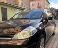 Черный Ниссан Тиида, объемом двигателя 1.6 л и пробегом 150 тыс. км за 7300 $, фото 1 на Automoto.ua