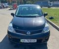 Черный Ниссан Тиида, объемом двигателя 1.6 л и пробегом 136 тыс. км за 10500 $, фото 1 на Automoto.ua
