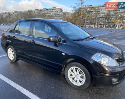 Черный Ниссан Тиида, объемом двигателя 1.6 л и пробегом 138 тыс. км за 7700 $, фото 4 на Automoto.ua