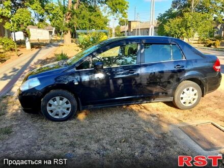 Черный Ниссан Тиида, объемом двигателя 1.6 л и пробегом 200 тыс. км за 4999 $, фото 1 на Automoto.ua