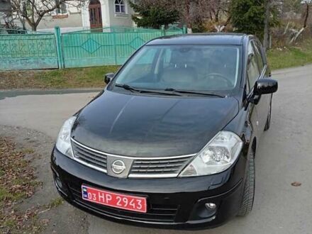 Черный Ниссан Тиида, объемом двигателя 1.6 л и пробегом 240 тыс. км за 7900 $, фото 1 на Automoto.ua