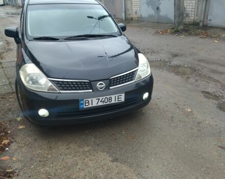 Черный Ниссан Тиида, объемом двигателя 1.6 л и пробегом 220 тыс. км за 5498 $, фото 1 на Automoto.ua