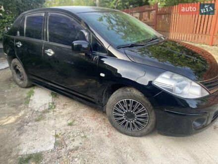 Черный Ниссан Тиида, объемом двигателя 1.6 л и пробегом 182 тыс. км за 3200 $, фото 1 на Automoto.ua