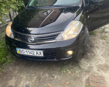 Черный Ниссан Тиида, объемом двигателя 1.6 л и пробегом 182 тыс. км за 3250 $, фото 1 на Automoto.ua