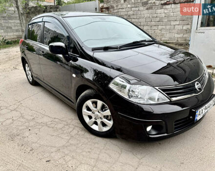 Черный Ниссан Тиида, объемом двигателя 1.6 л и пробегом 95 тыс. км за 10200 $, фото 1 на Automoto.ua