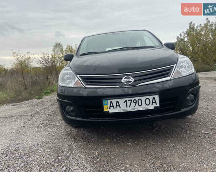 Черный Ниссан Тиида, объемом двигателя 1.6 л и пробегом 60 тыс. км за 9600 $, фото 1 на Automoto.ua
