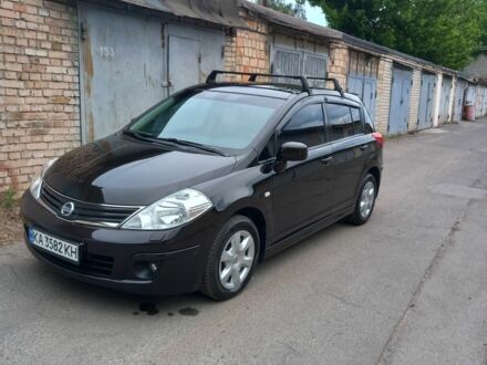 Черный Ниссан Тиида, объемом двигателя 1.6 л и пробегом 60 тыс. км за 10000 $, фото 1 на Automoto.ua