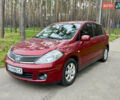 Красный Ниссан Тиида, объемом двигателя 1.6 л и пробегом 100 тыс. км за 6500 $, фото 1 на Automoto.ua