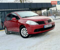 Красный Ниссан Тиида, объемом двигателя 1.6 л и пробегом 186 тыс. км за 6850 $, фото 1 на Automoto.ua
