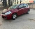 Красный Ниссан Тиида, объемом двигателя 1.6 л и пробегом 145 тыс. км за 6300 $, фото 1 на Automoto.ua