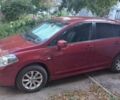 Красный Ниссан Тиида, объемом двигателя 1.6 л и пробегом 97 тыс. км за 8507 $, фото 1 на Automoto.ua