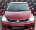Красный Ниссан Тиида, объемом двигателя 1.6 л и пробегом 155 тыс. км за 6800 $, фото 1 на Automoto.ua