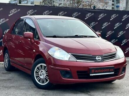 Красный Ниссан Тиида, объемом двигателя 1.6 л и пробегом 155 тыс. км за 6800 $, фото 1 на Automoto.ua