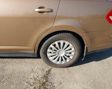 Желтый Ниссан Тиида, объемом двигателя 1.6 л и пробегом 325 тыс. км за 5350 $, фото 8 на Automoto.ua