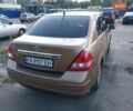Желтый Ниссан Тиида, объемом двигателя 1.6 л и пробегом 325 тыс. км за 5350 $, фото 3 на Automoto.ua