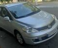 Серый Ниссан Тиида, объемом двигателя 1.6 л и пробегом 171 тыс. км за 6000 $, фото 1 на Automoto.ua