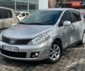 Серый Ниссан Тиида, объемом двигателя 1.6 л и пробегом 244 тыс. км за 5700 $, фото 2 на Automoto.ua
