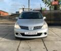 Сірий Ніссан Тііда, об'ємом двигуна 1.5 л та пробігом 107 тис. км за 7590 $, фото 1 на Automoto.ua