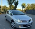 Сірий Ніссан Тііда, об'ємом двигуна 1.6 л та пробігом 74 тис. км за 8499 $, фото 1 на Automoto.ua