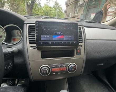 Серый Ниссан Тиида, объемом двигателя 1.5 л и пробегом 77 тыс. км за 7500 $, фото 11 на Automoto.ua