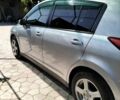 Сірий Ніссан Тііда, об'ємом двигуна 1.5 л та пробігом 150 тис. км за 7800 $, фото 2 на Automoto.ua