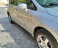 Сірий Ніссан Тііда, об'ємом двигуна 1.5 л та пробігом 150 тис. км за 7800 $, фото 1 на Automoto.ua