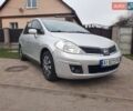 Серый Ниссан Тиида, объемом двигателя 1.6 л и пробегом 285 тыс. км за 3800 $, фото 1 на Automoto.ua