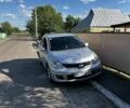 Сірий Ніссан Тііда, об'ємом двигуна 1.8 л та пробігом 258 тис. км за 4503 $, фото 1 на Automoto.ua