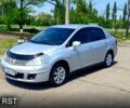 Серый Ниссан Тиида, объемом двигателя 1.6 л и пробегом 320 тыс. км за 5700 $, фото 1 на Automoto.ua