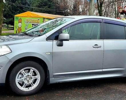 Серый Ниссан Тиида, объемом двигателя 1.6 л и пробегом 199 тыс. км за 5390 $, фото 1 на Automoto.ua