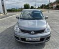 Серый Ниссан Тиида, объемом двигателя 1.6 л и пробегом 115 тыс. км за 7000 $, фото 1 на Automoto.ua
