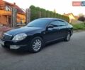 Черный Ниссан Теана, объемом двигателя 2.4 л и пробегом 245 тыс. км за 5500 $, фото 1 на Automoto.ua