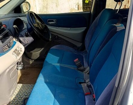 Серый Ниссан Тино, объемом двигателя 2 л и пробегом 315 тыс. км за 1100 $, фото 7 на Automoto.ua