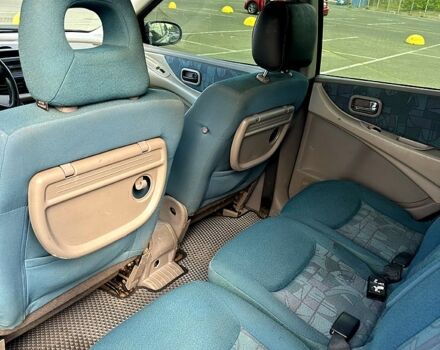 Синий Ниссан Тино, объемом двигателя 2 л и пробегом 215 тыс. км за 2850 $, фото 2 на Automoto.ua