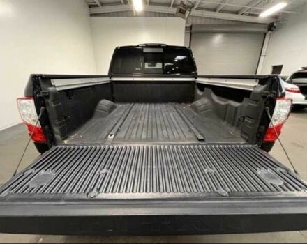 Черный Ниссан Титан, объемом двигателя 5.5 л и пробегом 150 тыс. км за 25000 $, фото 2 на Automoto.ua