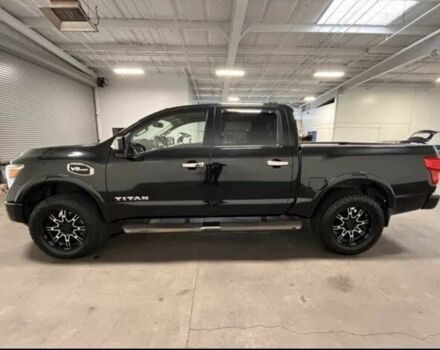 Черный Ниссан Титан, объемом двигателя 5.5 л и пробегом 150 тыс. км за 25000 $, фото 1 на Automoto.ua
