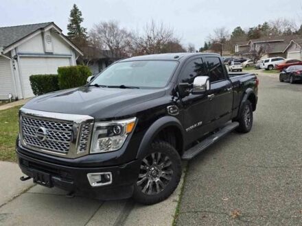 Черный Ниссан Титан, объемом двигателя 5.5 л и пробегом 150 тыс. км за 25000 $, фото 1 на Automoto.ua